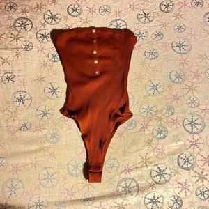 Brown body suit